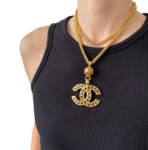 chanel clover necklace|Chanel long necklace with logo.